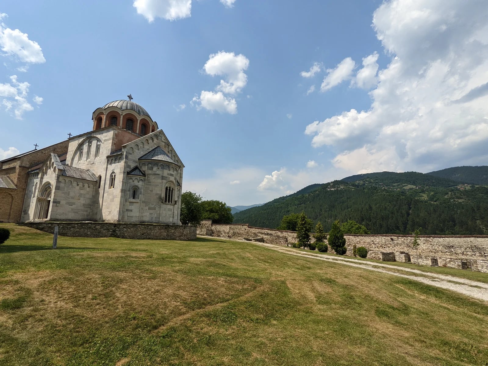 Studenica Monastery surrounded by wooded hills in Serbia.